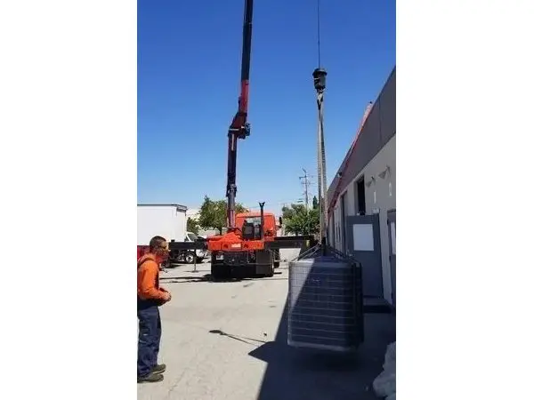 A crane is being lifted into the air.