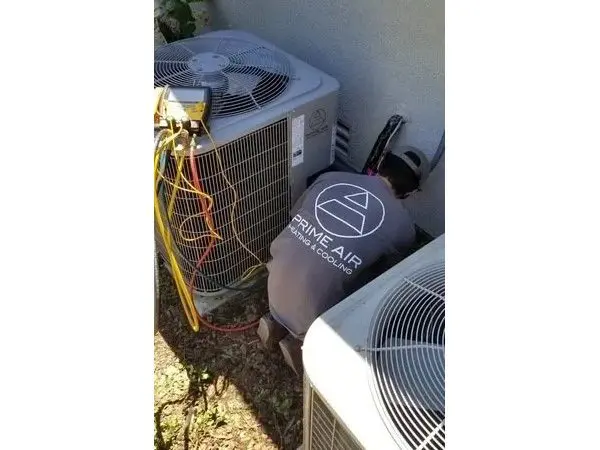 A couple of air conditioners that are outside