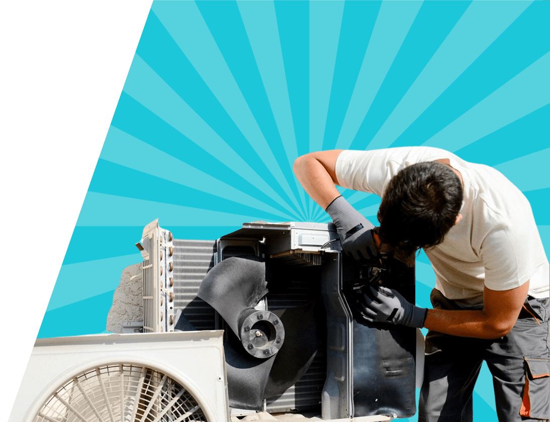 A man working on an air conditioner.